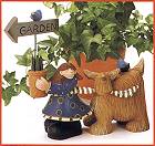 ww7603 Girl holding flower pot with a garden sign and a dog trailing along