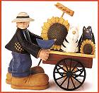 ww7611 Country Boy with a market wagon of cats and sunflowers
