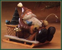 WW2404 Santa on sled with a basket, tree and bell