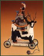 WW2414 Santa grabbing the moon while riding a spotted cow with branch antlers