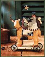 WW2415 Santa with a sack of gifts on a reindeer with a quilted saddle blanket
