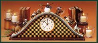 WW2616 Checkered mantel clock with skiers, sledders, snowman, cat & dog on its slopes