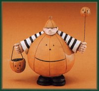 WW6029 Kid in a pumpkin shell with a pumpkin hat, pumpkin balloon, and pumpkin basket