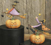 WW6105 Witches on broomsticks flying over a pumpkin