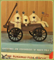 WW7703 Three golden puppy dogs in a wagon