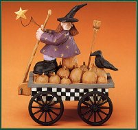 WW6028 Witch and a crow on a wagon full of pumpkins